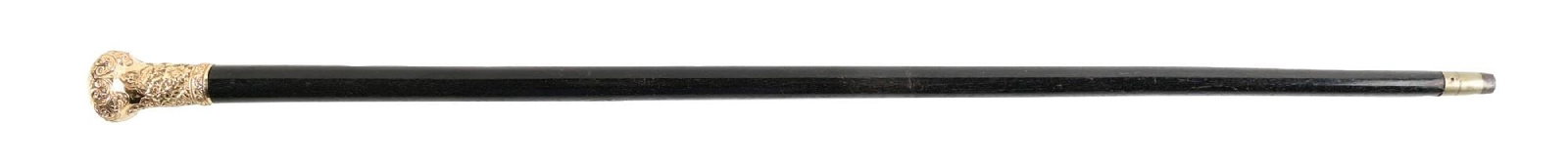 CANE WITH FLORAL REPOUSSE GOLD-FILLED HALLMARKED HANDLE AND EBONY SHAFT: C. 1885–1905. Presentation walking cane featuring an ornately repoussé gold-toned handle with elaborate floral and scroll decoration and large domed pommel, mounted to a dark hardwood