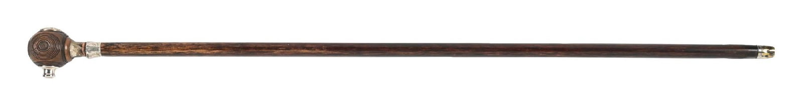 ANTIQUE SIREN GADGET CANE: C. 1890–1920. A fantastic siren gadget cane featuring a wooden shaft with a hallmarked sterling silver collar and brass ferrule. A compass is set atop the handle. These canes were commonly used