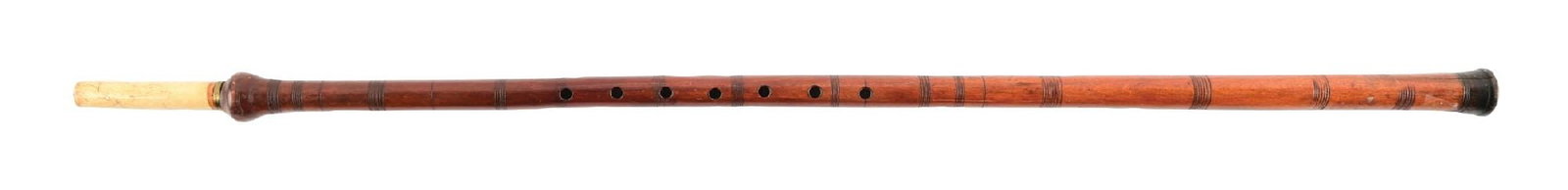 ANTIQUE HAND-CARVED MUSICAL GADGET WALKING STICK CANE: C. 1880–1910. Musical flute walking cane with turned bone mouthpiece handle mounted to a carved hardwood shaft drilled with finger holes forming a flute. Shaft displays turned decorative bands