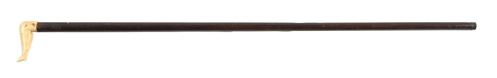 CLASSIC 19TH CENTURY NAUGHTY NELLIE CANE: C. 1850–1900. A classic antler cane depicting the “Naughty Nellie” leg, forming the handle. The carving displays typical folk art detail with natural age patina. The handle is mounte
