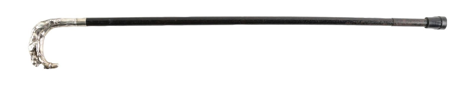 ANTIQUE WALKING CANE W/ .800 SILVER FIGURAL TIGER HANDLE AND DARK SHAFT: C. 1900–1920. Figural walking cane featuring a silver handle in the form of a tiger across a U-shaped crook. The handle is mounted to a tree-inspired silver collar with worn hallmarks, likely