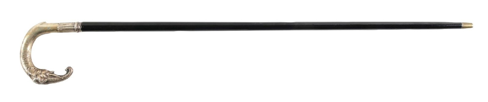 WALKING CANE WITH CARVED FIGURAL ELEPHANT SILVER HANDLE AND EBONY SHAFT: C. 1900–1925. Figural elephant-head walking cane featuring a silver-tone metal crook handle transitioning into a decorative collar stamped “PK” with shield-form hallmark. The “