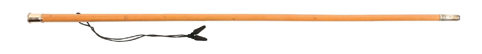 ANTIQUE RIDING CAP GOLD HANDLE STICK W/ WOOD SHAFT: C. 1900–1920. Presentation-style walking cane featuring a cylindrical rose gold-toned metal pommel engraved with an intertwined monogram. Mounted to a wooden honey-toned shaft fitted with a wris