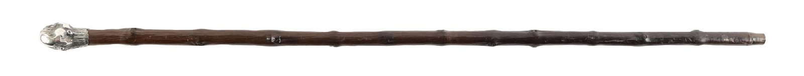 CANE W/ ENGLISH STERLING SILVER KNOB AND KNOTTED WOOD SHAFT: C. 1890–1915. Walking cane featuring a silver handle modeled in a naturalistic tree trunk form with textured bark surface and knot details, mounted to a dark hardwood shaft. Hallmarks include a 
