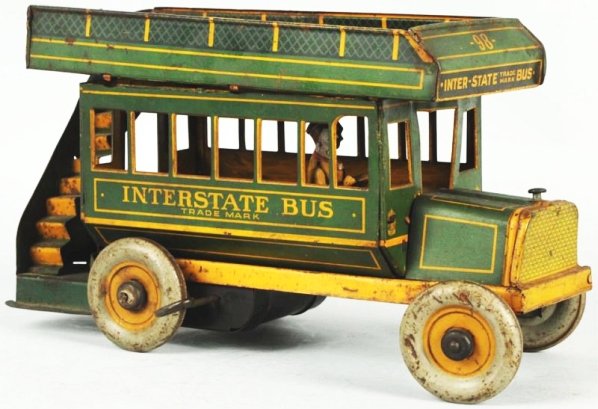Tin Litho Strauss Wind-Up Interstate Bus Toy.: American. Original driver. Top roof needs to be tabbed back in and bus has some overall pitting and wear throughout. Condition (Good). Size 11" L.