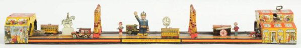 Lot of 2: Tin Litho Traffic Toys.: American. Includes one Unique Art Lincoln Tunnel with original box with one end flap detached but present. Also includes one Marx Main Street with some scratching and wear. Condition (Excellent). Size