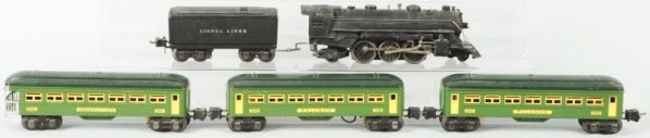 Lionel O-Gauge No. 1666 Passenger Train Set.: Pre-war. Tinplate. Includes no. 1666 steam-type engine, matching Lionel Lines tender, and three 2600 series passenger cars. Includes two original boxes with missing flaps. Set has minor scratching and
