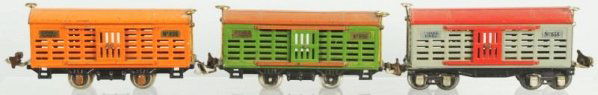 Lot of 3: Lionel O-Gauge Freight Train Cars.: Pre-war. Includes no. 806 cattle car in scarce all-orange with copper journal boxes, no. 806 cattle car with terracotta roof and side rails (missing one door handle and has no journal boxes), and no.