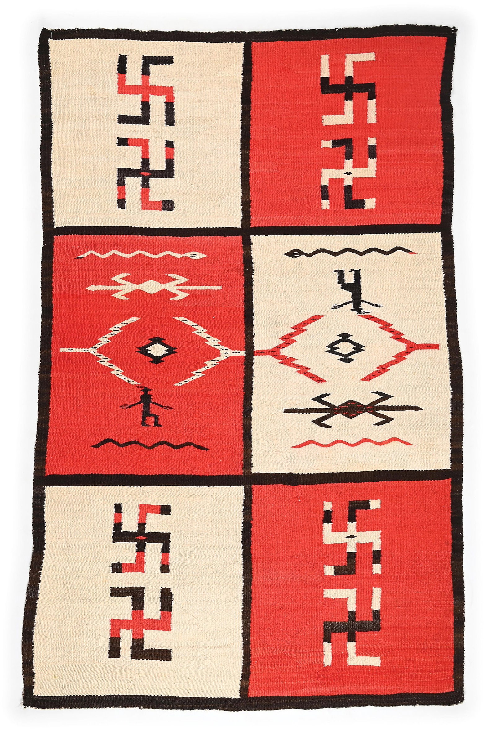 NAVAJO (DINÉ) WEAVING: Circa first quarter 20th century. The field divided into six squares, the two central squares containing snakes, a man wearing a hat with feathers, water bug design, and serrated diamonds, each of the