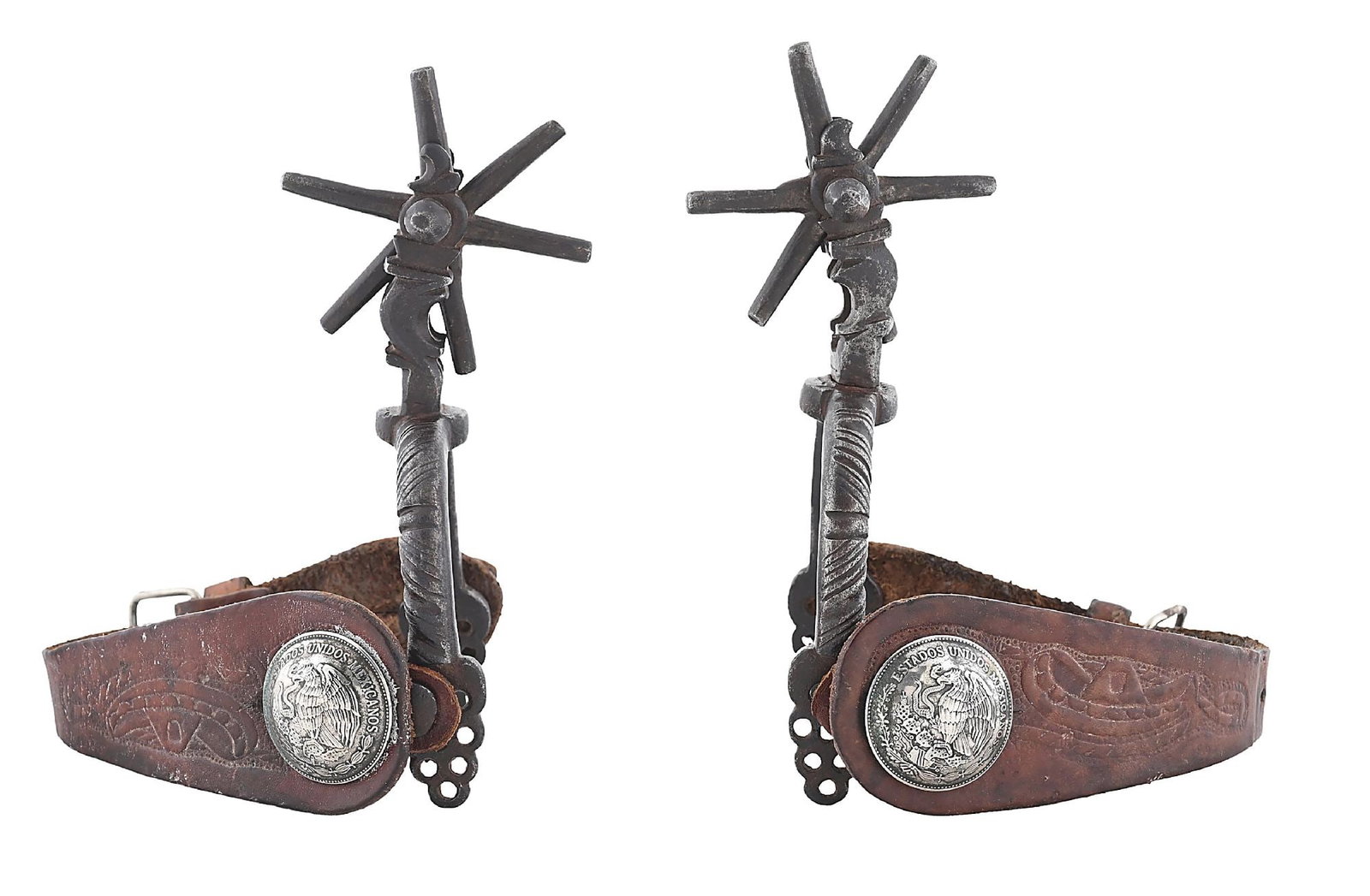 EARLY MEXICAN SPURS WITH LEATHER STRAPS AND COIN CONCHOS: Hand forged Mexican spurs with chased iron bands in a Spanish Colonial style. Includes older straps with silver Mexican coin conchos. 1/2" band, 2" shank, 2-7/8" rowels. Dimensions: Overall: 9 - 1/2" 