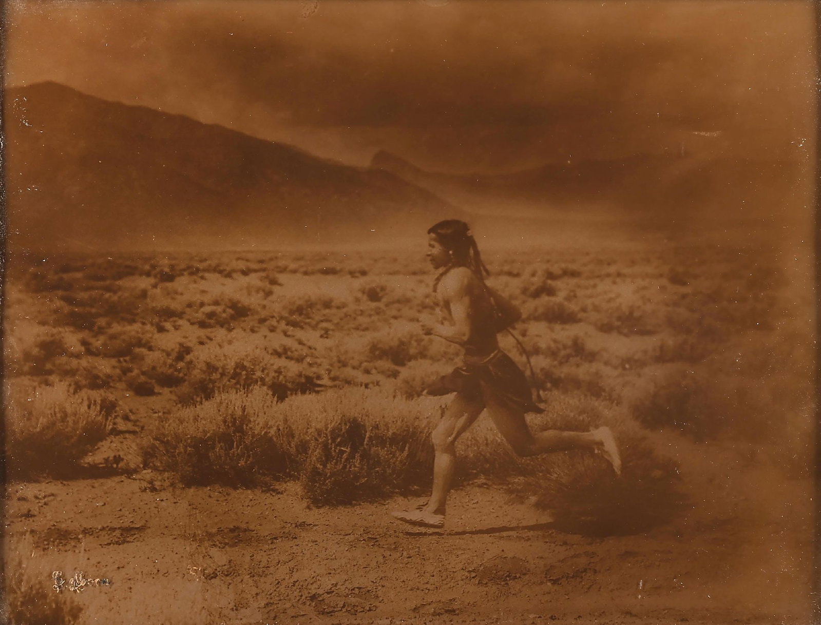 CARL MOON (AMERICAN, 1878-1948): The Runner Taos, view #2 left gold orotone photograph signed "C. Moon" lower-left corner sight: 10-1/2" x 13-1/2" framed: 21-1/2" x 25-1/2" in original ornate gold tone wood frame Dimensions: Frame: