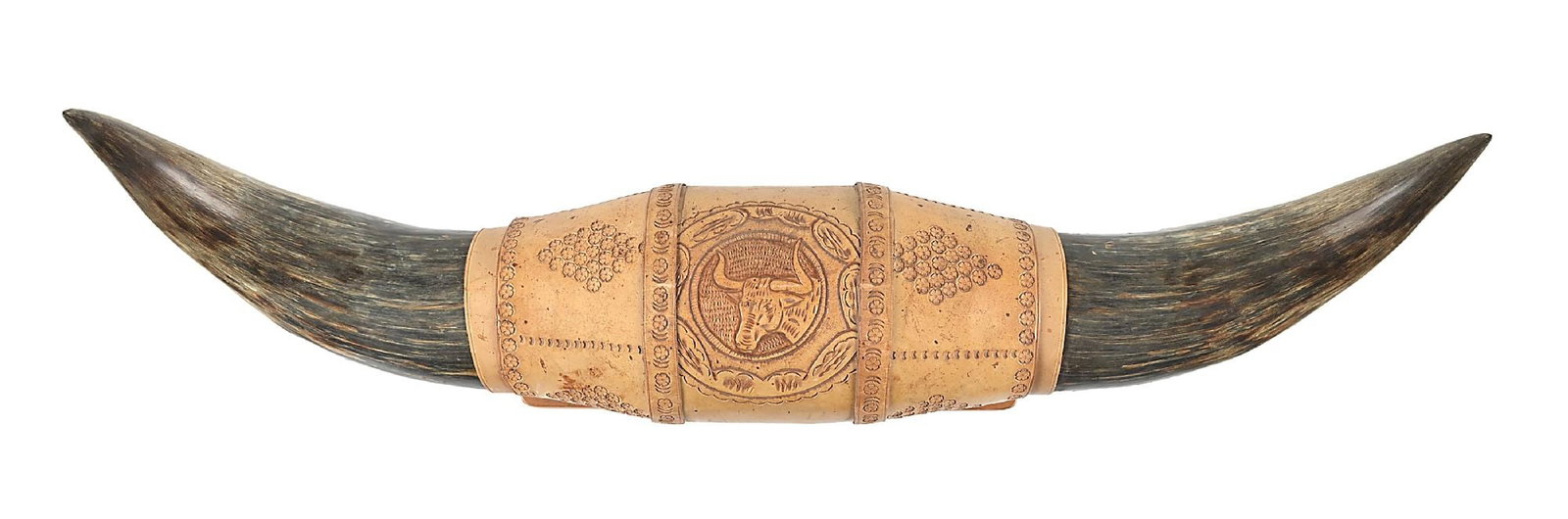 A PAIR OF BULL HORNS: With a central tooled leather done in a floral design with a central rosette containing a longhorn steer head. Wall-mounted. This is not a standard shippable item and will require 3rd party shipping o