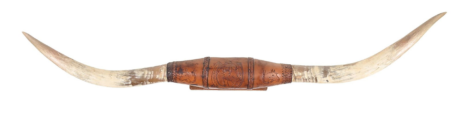 A PAIR OF LONGHORNS: Mid-20th century. With central tooled leather, showing horse heads inside a horseshoe. Wall-mounted. This is not a standard shippable item and will require 3rd party shipping or pickup arrangements to
