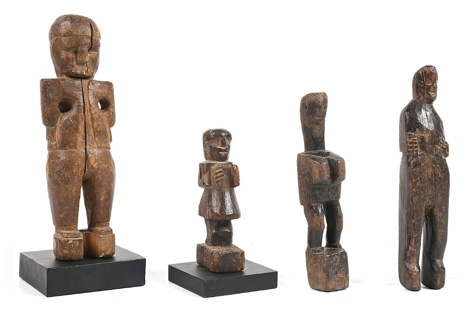 LOT OF 4: GUATEMALAN WOODEN CARVED TOYS: Circa turn of the 19th century. Two with metal stands. Each depicting a human figure.Largest - 3" W x 11" H w/ stand Dimensions: Largest: 4" x 4" x 10 - 3/4".