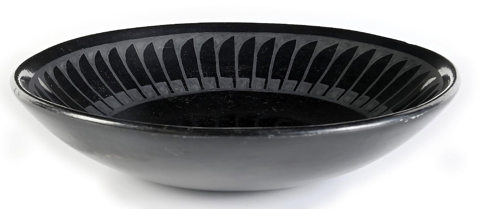 SAN ILDEFONZO BLACKWARE BOWL BY MARIA & SANTANA: Incised on base "Maria + Santana". Large bowl with a traditional overall eagle feather pattern. Some scratches and marks to base. Dimensions: 12 - 1/2" Dia. x 2 - 3/4" T.