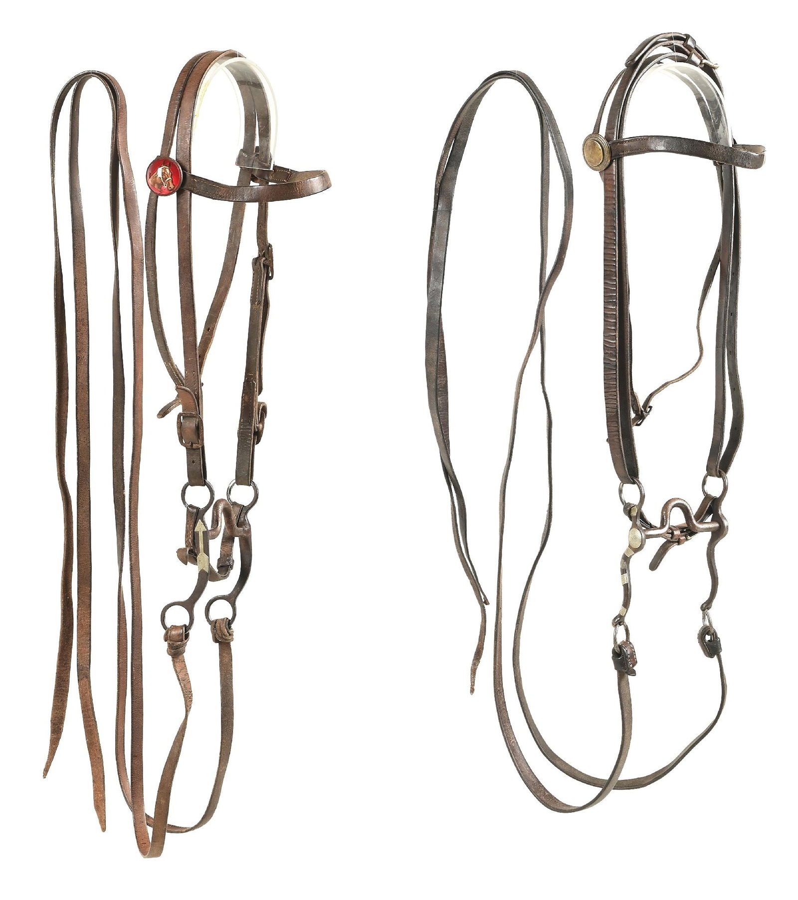 LOT OF 2: CROCKETT AND MCCHESNEY BITS ON AL FURSTNOW MARKED BRIDLES: Lot consists of: (A) Crockett inside cheek marked 'S' shank bit with silver conchos and bar patterns. Bridle has die struck brass conchos. Bridle is maker stamped: AL FURSTNOW / MILES CITY MONT. (B) M