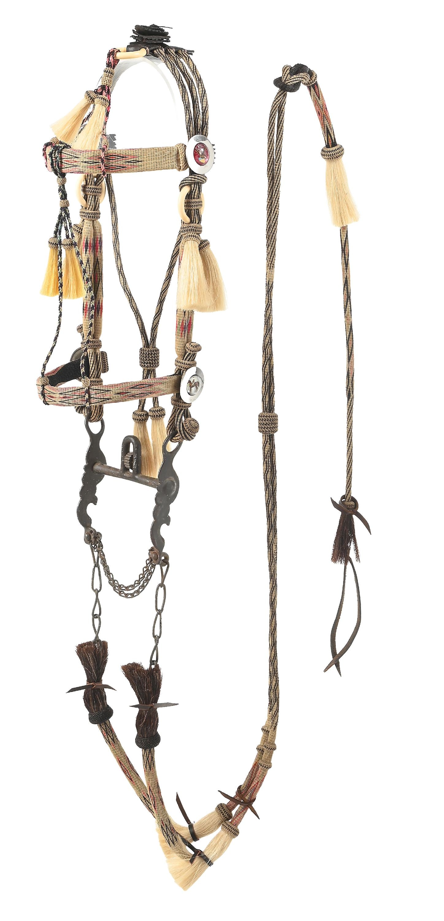 DEER LODGE HORSEHAIR BRIDLE: Finished in bright colors, tight, quality work dominates this Montana Penitentiary bridle, hot pink, sky blue, red, and black on a cream back. The elements are flat and the tassels are dyed multi-colo