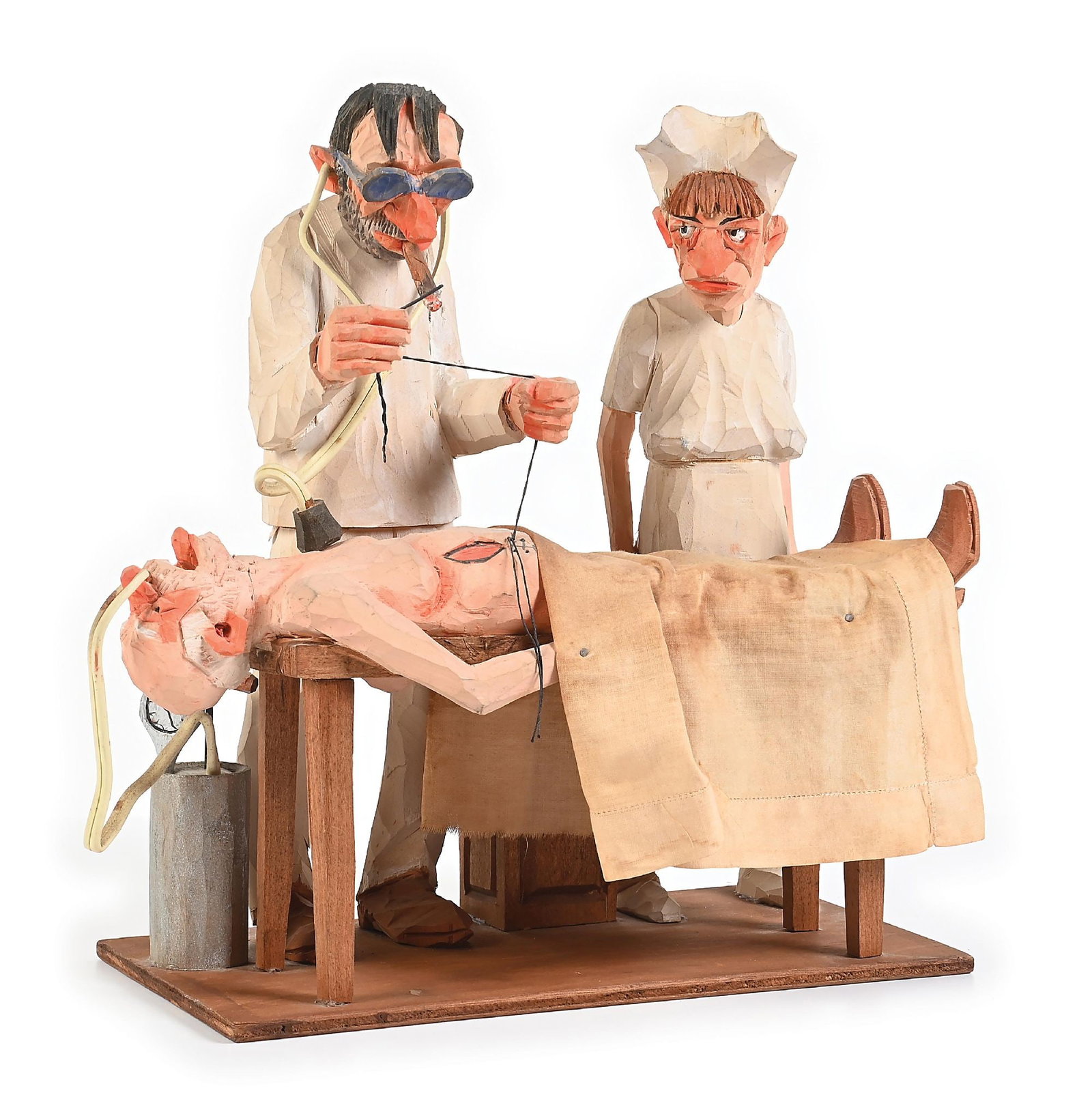 ANDY ANDERSON WOOD CARVING “THE OPERATION”: C. 1950s. Complete and in excellent condition. Original colors are still vibrant. Figures signed on back by artist. 5-1/4" W x 11" L x 11" H Dimensions: Approx: 12" x 6" x 11 - 1/2".