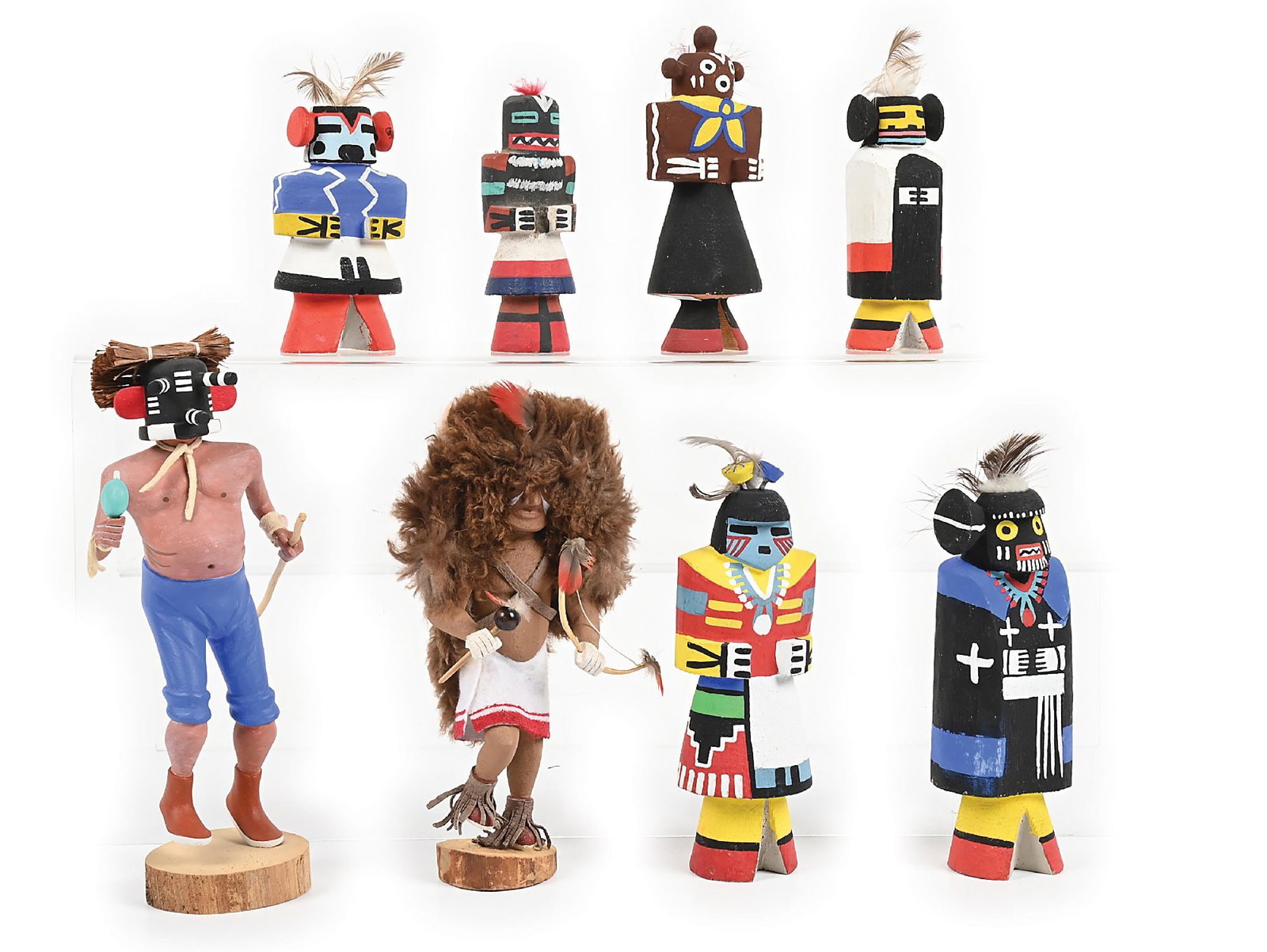 LOT OF 8: MINIATURE HOPI KACHINA (KATSINA) CARVINGS: Circa last quarter 20th century. (A) Signed on base "Lorenzo Martan 'Kwikwilyaka' - Mocking Kachina". (B) Signed on base "Buffalo Dancer Root". (C) Remaining five done in Route 66 style. Dimensions: L