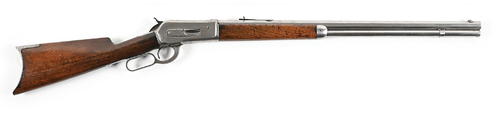 (A) WINCHESTER MODEL 1886 LEVER ACTION RIFLE IN .40-82.: Circa 1892. Classically configured with octagon barrel, sights, solid frame, and 2-piece walnut stocks with crescent rifle butt plate. CONDITION: Good. Metal has been cleaned bright with a few areas o