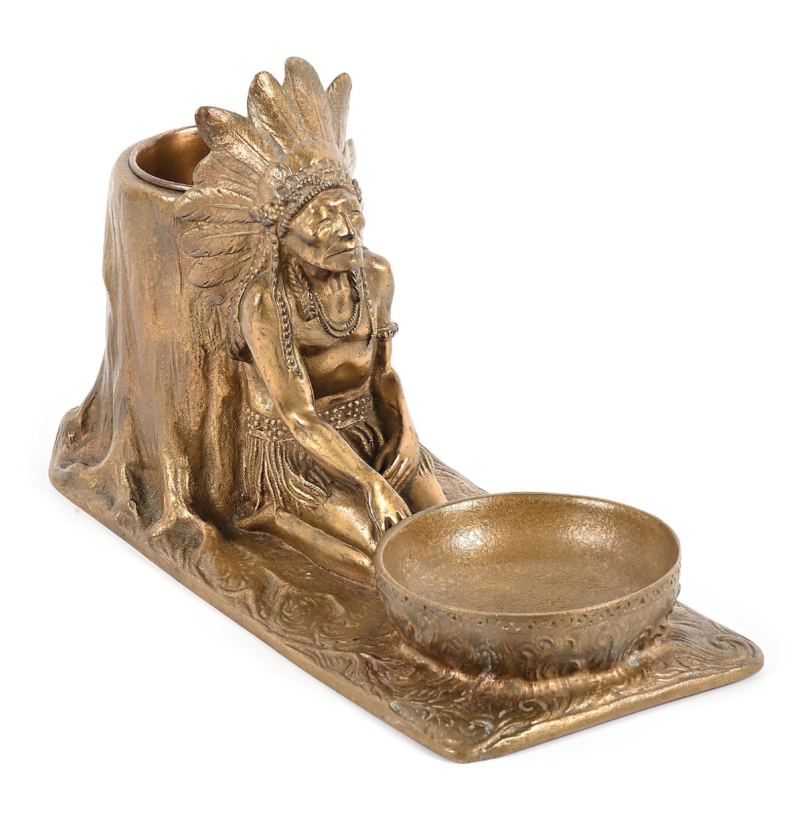BRONZE FIGURAL ASHTRAY WITH CIGAR HOLDER: Bronze 10-1/2" L x 4-1/2" W x 6-1/4" H Depicting a Native American chief leaning up against a stump. Maker stamped on the bottom: TIFFANY STUDIOS / NEW YORK / 908 Dimensions: 10 - 1/2" x 4 - 1/2" x 6