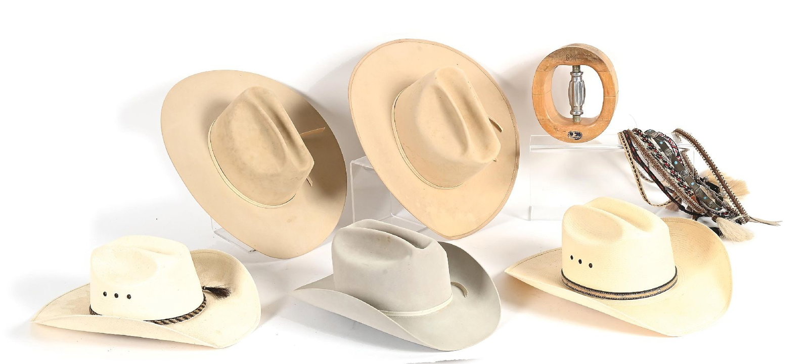 LOT OF HARLEY MAY COWBOY HATS: Five felt and summer straw hats, multiple hitched horsehair hat bands, and a hat stretcher. Resistol and other custom makers. Sizes 7-1/4 to 7-3/8. Provenance Ex. Harley May Dimensions: Largest: 16"