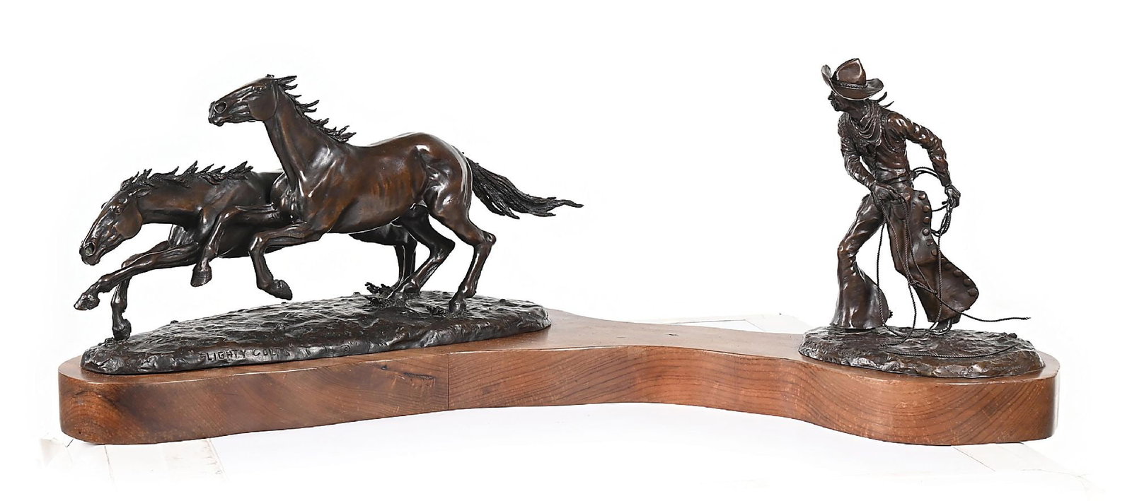 JIM STUCKENBERG (1943 -): Flighty Colts and Backhand Loop Bronzes (A) 17-1/4" x 7" x 8-1/4" (B) 7" x 5-1/4" x 8-1/2" Titled on the front Signatures incised on the back of the sculpture bases: Jim Stuckenberg, and numbered