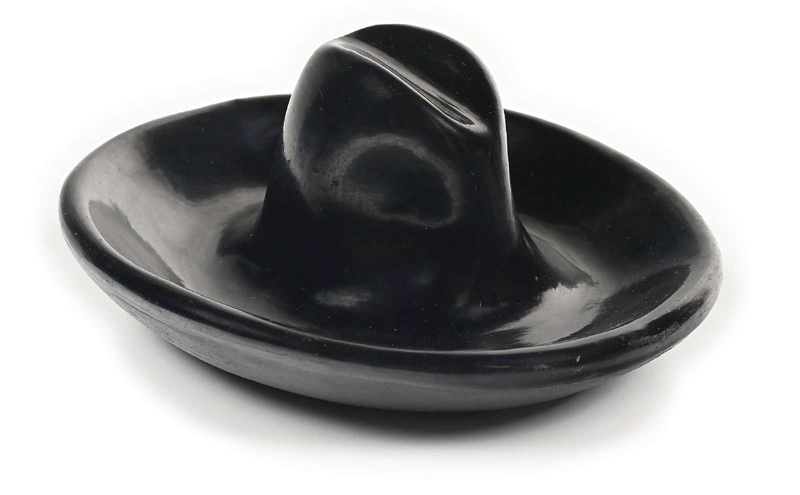 MARIA MARTINEZ (1887-1980) & JULIAN MARTINEZ ("POCANO", 1879-1943) SAN ILDEFONSO (P’OHWHOGEH): First quarter 20th century. In the form of a cowboy hat, signed on base "Marie + Julian". 5" Dia. x 2" H. Condition: With a few small flakes. Dimensions: 5" x 4 - 1/2" x 2".