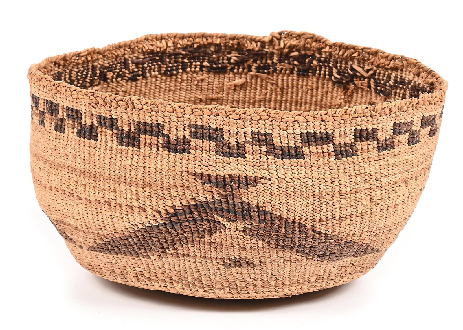 KLAMATH MODOC BASKET: First quarter 20th century. Twine with an overall geometric pattern. 6-1/2" Dia. x 3-1/2" H. Dimensions: 6 - 1/2" Dia. x 3 - 1/2".