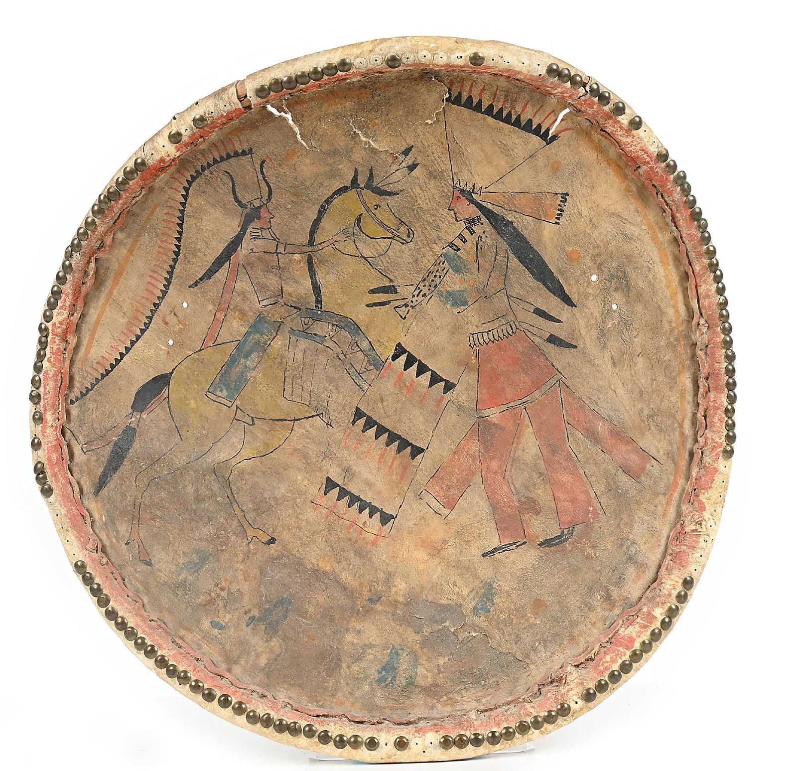 PLAINS SHIELD OR POLE BANNER: Circa early 20th century. Probably from a Wild West show, with standing and mounted ledger figures and rim done with brass tacks, several missing. Was on display for five years at the Royal Museum of