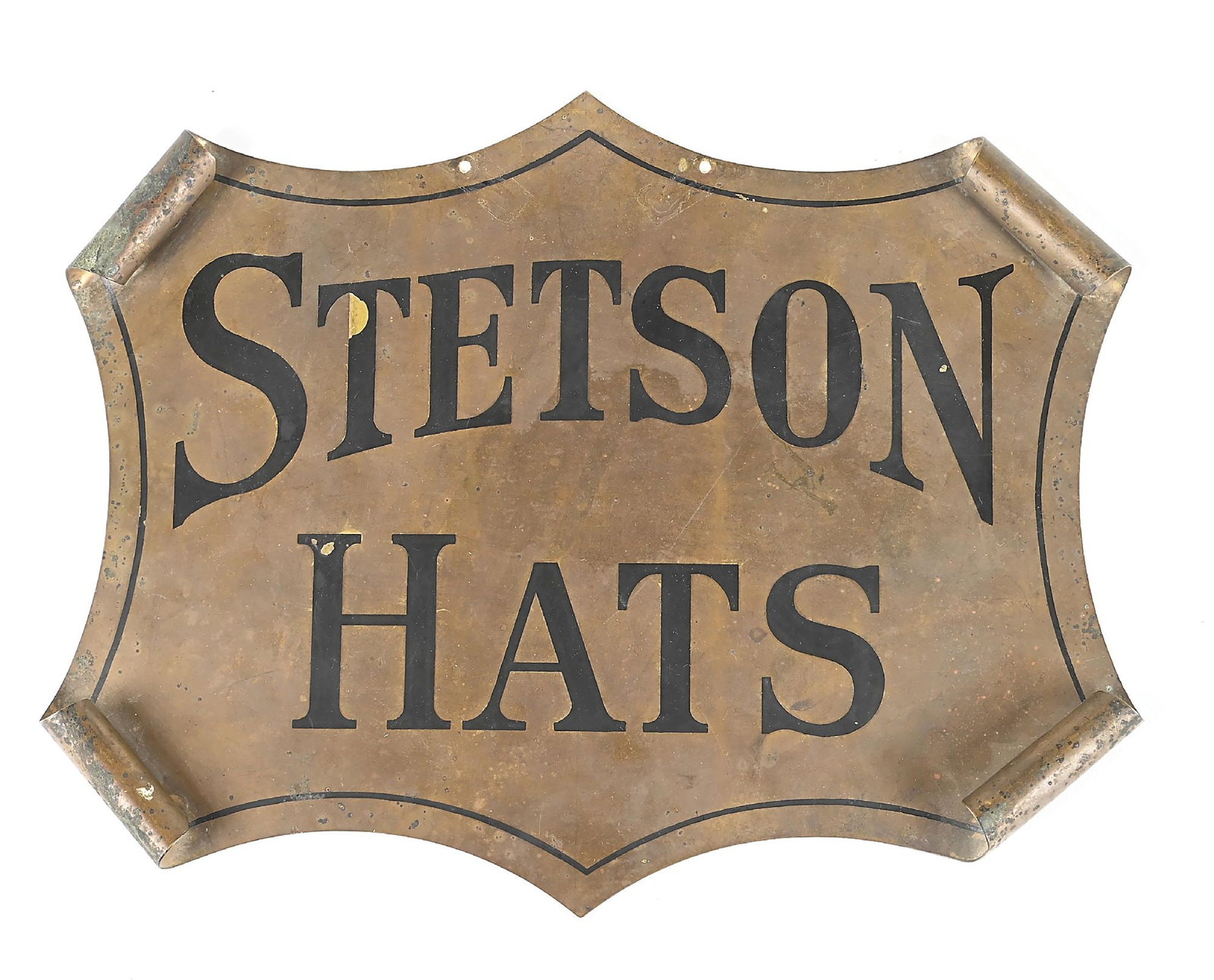 STETSON HAT SIGN: 1920s brass dealer sign with painted letters and pin striping. Creative shape with the curled edges meant to resemble a historic document or map. Nice unpolished dark gold patina. Provenance Ex Collec