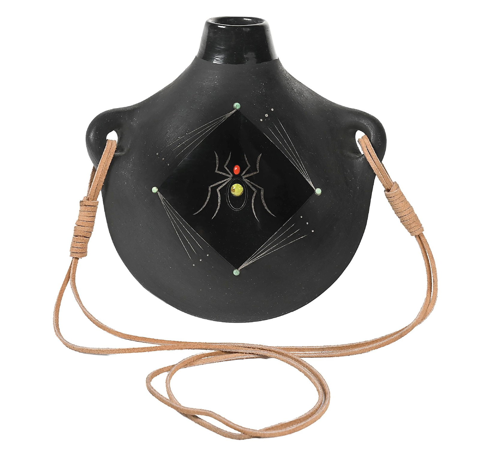 BARBARA GONZALES (TAN MOO-WHE, B. 1947) SAN ILDEFONSO (P’OHWHOGEH) POTTERY CANTEEN: Contemporary. Blackware depicting a spider encased in a diamond shape. Turquoise and coral cabochon and leather strap. Incised on base "Tan Moo-Whe". 8" L x 4" W x 8" H. Condition: Excellent. Dimensio