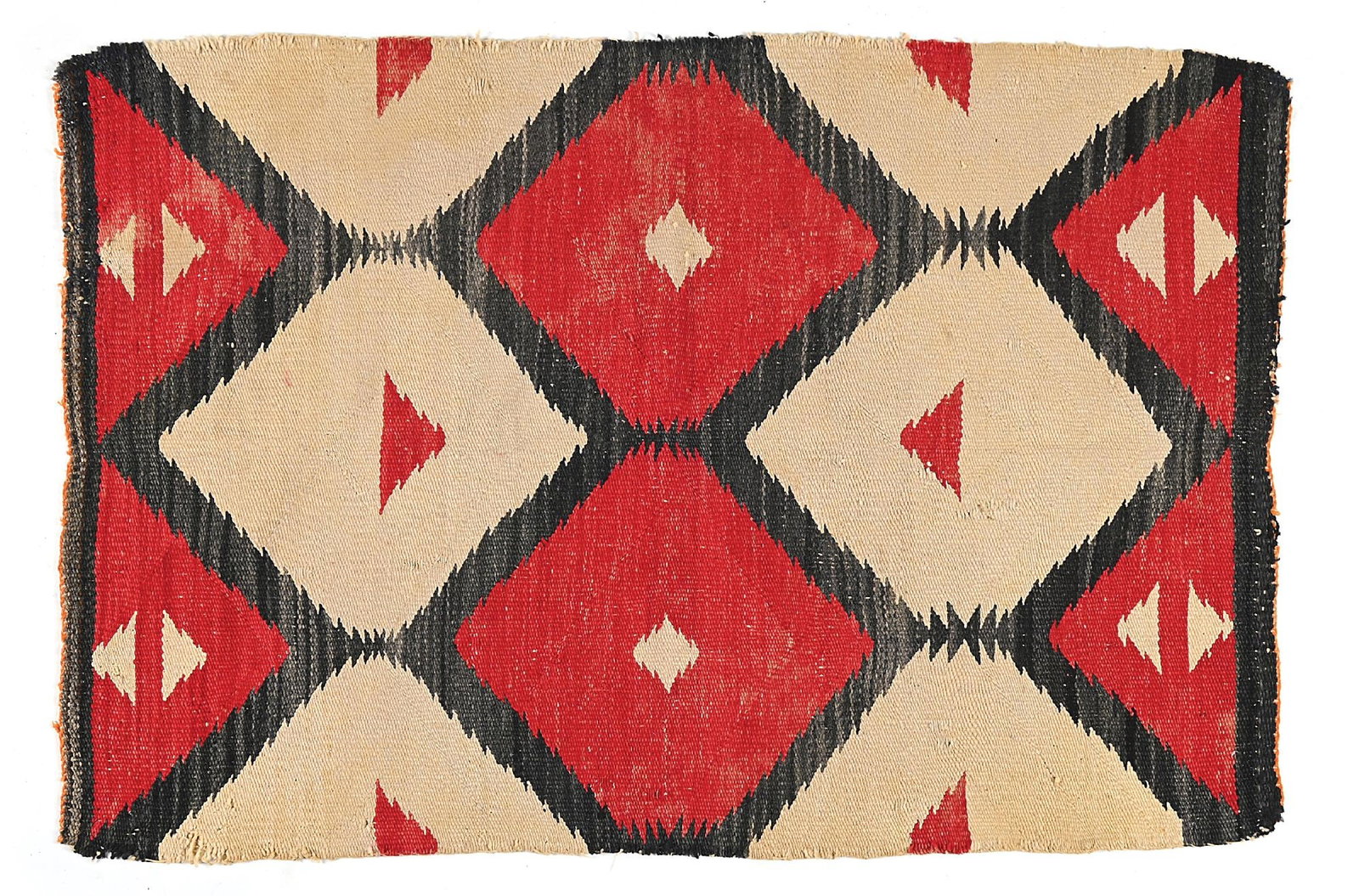 NAVAJO (DINÉ) RUG: With a field comprised of serrated diamonds and triangles at each end. 49" x 33" Colors: white, red, black Condition: Staining and selvedge damage on all sides. Dimensions: 33" x 49".