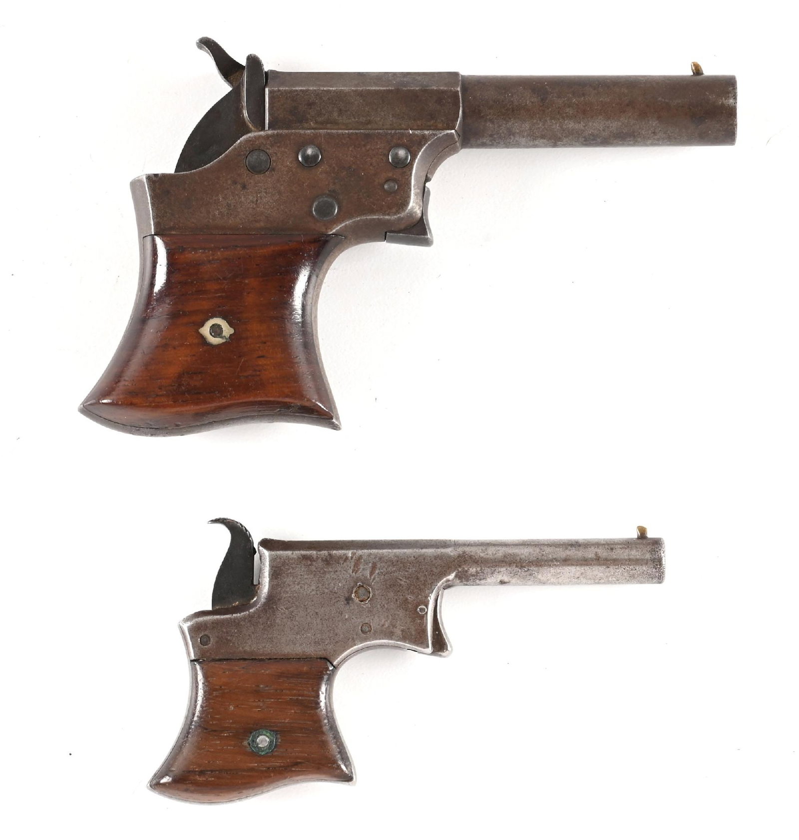 (A) LOT OF 2: REMINGTON SAW HANDLE VEST POCKET PISTOLS.: Lot consists of (A) Large frame, large caliber example. Made from 1865 through 1868. Blued with walnut grips and Remington legend atop the barrel. (B) Offered from 1865 through 1888. Remington legend 
