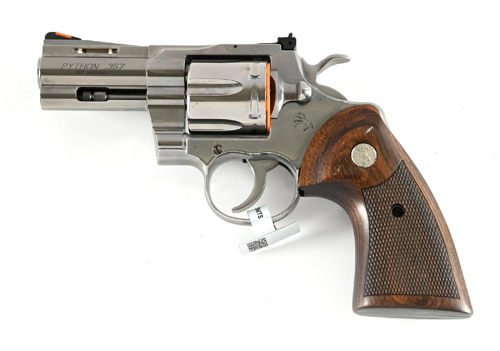 (M) BRIGHT STAINLESS COLT PYTHON DOUBLE ACTION REVOLVER WITH CASE: Desirable 3" stainless Python featuring vent rib, solid lug, target adjustable rear sight, red insert front sight, wide spur target hammer, and checkered walnut grips with silver medallions. CONDITION