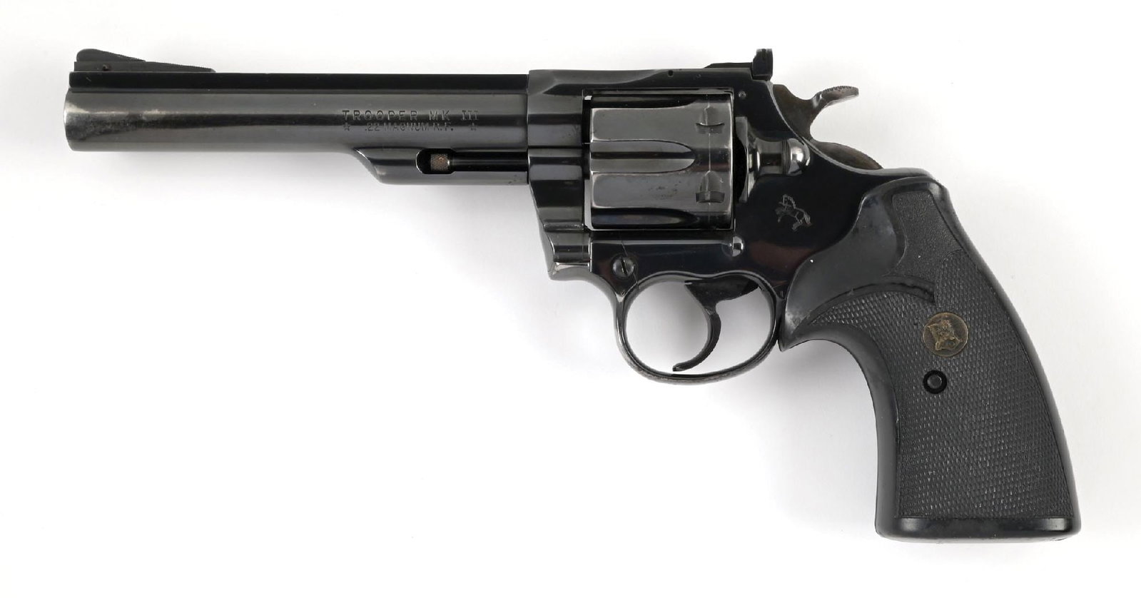 (M) COLT TROOPER MK III .22 MAGNUM DOUBLE ACTION REVOLVER.: Dates to 1980. Rather hard to find caliber, this gun is typical high polish blue finish, solid rib, adjustable rear sight, wide spur hammer, wide trigger, and Pachmayr rubber grips. CONDITION: Fine.