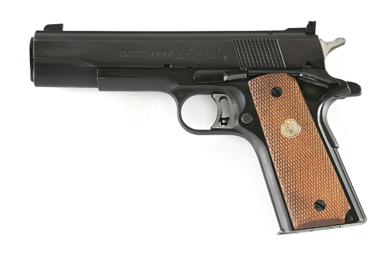 (C) COLT GOLD CUP NATIONAL MATCH .38 SPECIAL MID-RANGE 1911A1 SEMI-AUTOMATIC PISTOL (1963).: Dates to 1963. Only 8000 of these were manufactured from 1960 through 1971. Standard dual tone blue finish, slide with wide rib, adjustable target rear sight, light weight trigger, serrated flat mains