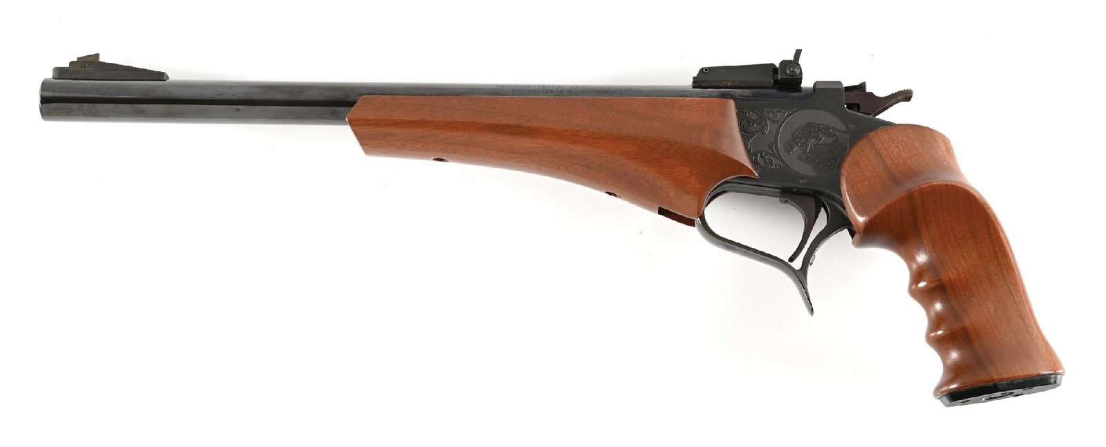 (M) THOMPSON CENTER CONTENDER SUPER 14 SINGLE SHOT PISTOL IN 7MM TCU.: Standard features include the high polish blue barrel with the front and rear sights, etched frame, finger groove walnut grip, and matching forearm. Comes with a shoulder rig. CONDITION: Excellent. Fi