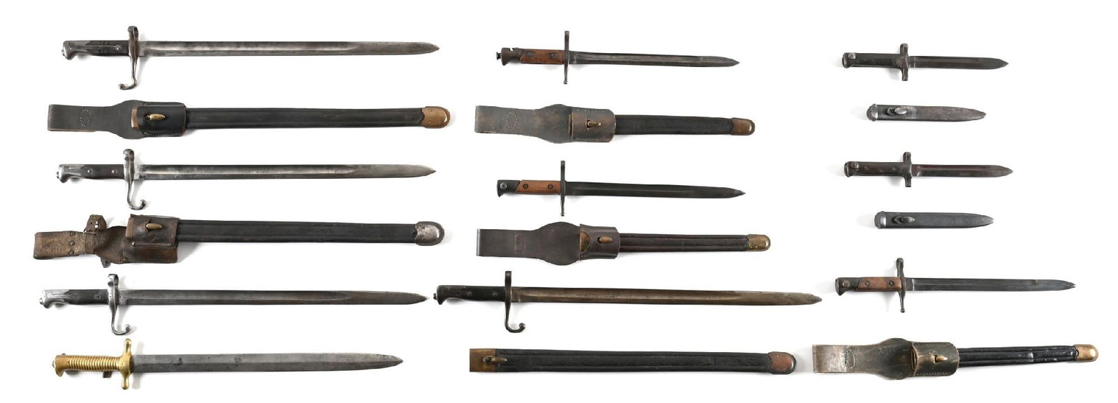 LOT OF 10: ITALIAN BAYONETS.: Lot consists of ten Italian bayonets including four Vetterli bayonets, three have scabbards and two have frogs. One has a modification where the quillon was down turned possibly for use as a fighting 