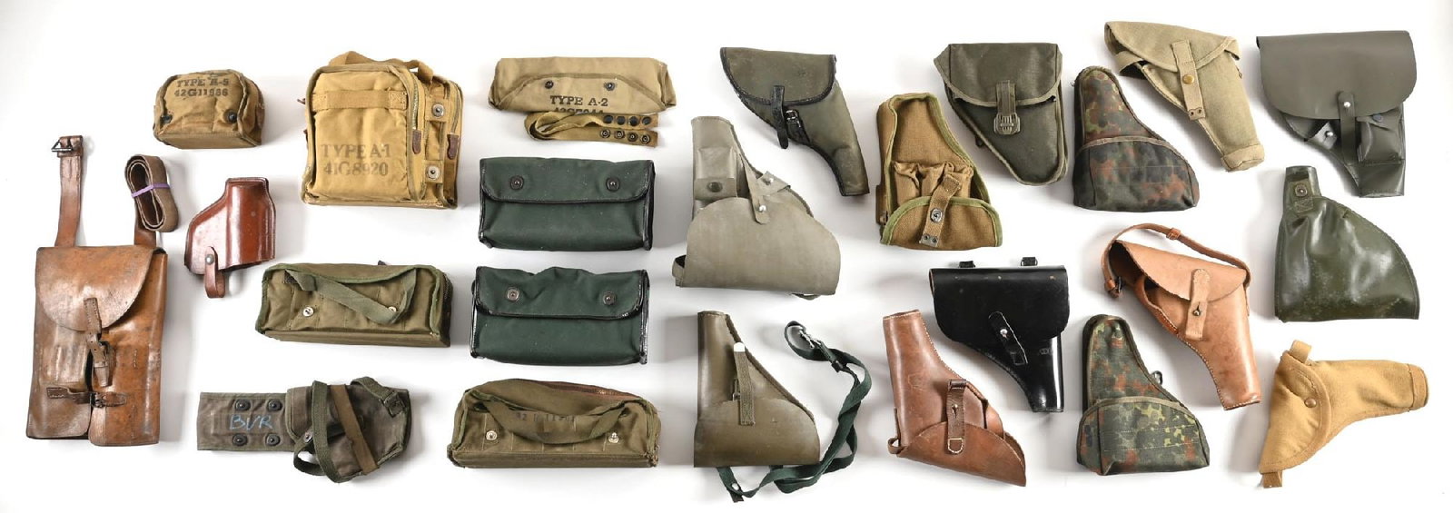 LARGE LOT OF FLARE GUN HOLSTER AND POUCHES.: Large grouping of WWII and post-War European and US holsters for various flare pistols as well as ammunition carriers. Some include replica flares. CONDITION: Good to Excellent.