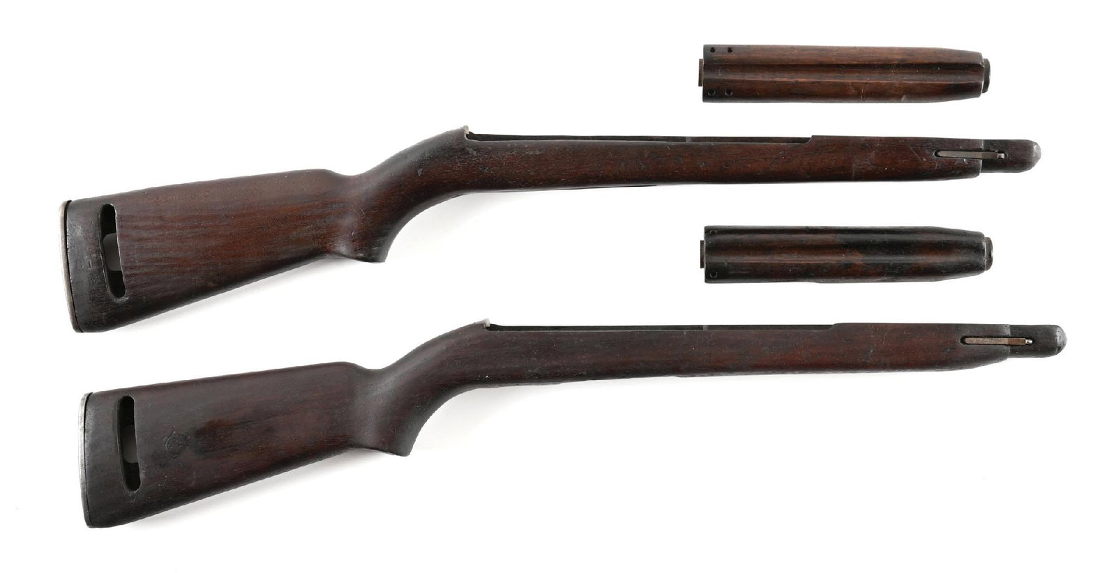 LOT OF 2: WINCHESTER AND INLAND M1 CARBINE STOCK SETS.: Lot consists of: (A) Inland low wood stock marked "IO" in the sling well with boxed "RIA / EB" cartouche on the left and large ordnance wheel on the right. 2-rivet top wood marked "IO" on the undersid