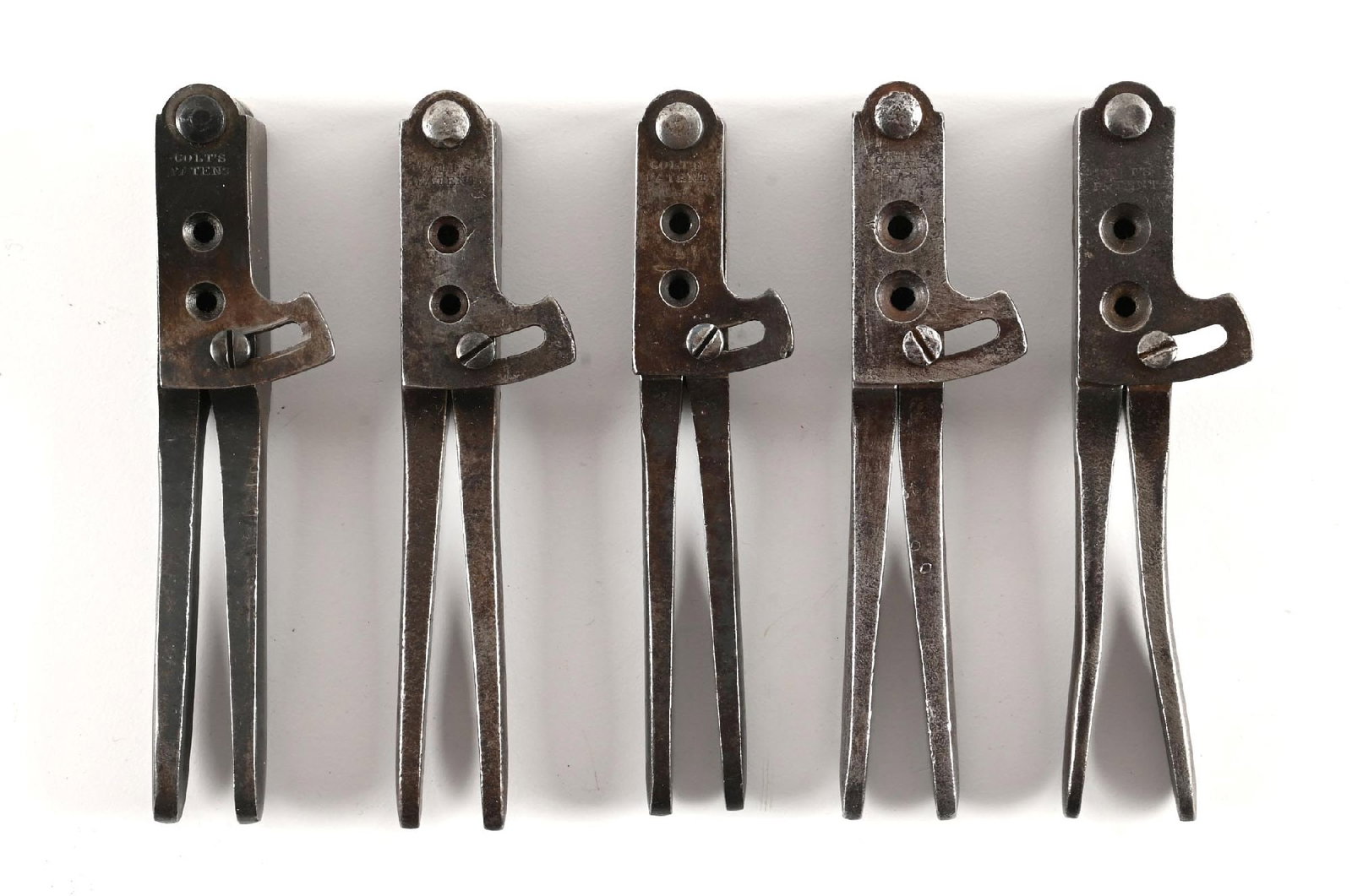 LOT OF 5: COLT'S PATENT .36 NAVY DUAL CAVITY MOLDS.: All are dual cavity iron molds. Each sports the Colts Patent stamp. Great for a cased 1851, 1861 or 1865 Navy revolver. CONDITION: All are very good to excellent. PROVENANCE: Ex. Castlerock Museum.
