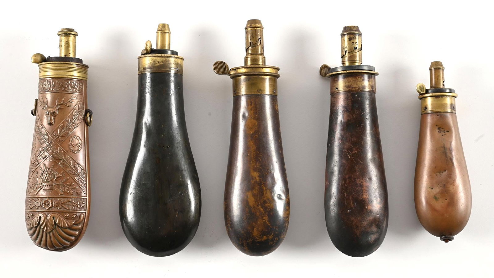 LOT OF 5: MID 19TH CENTURY BAG STYLE POWDER FLASKS. (1 of 2)