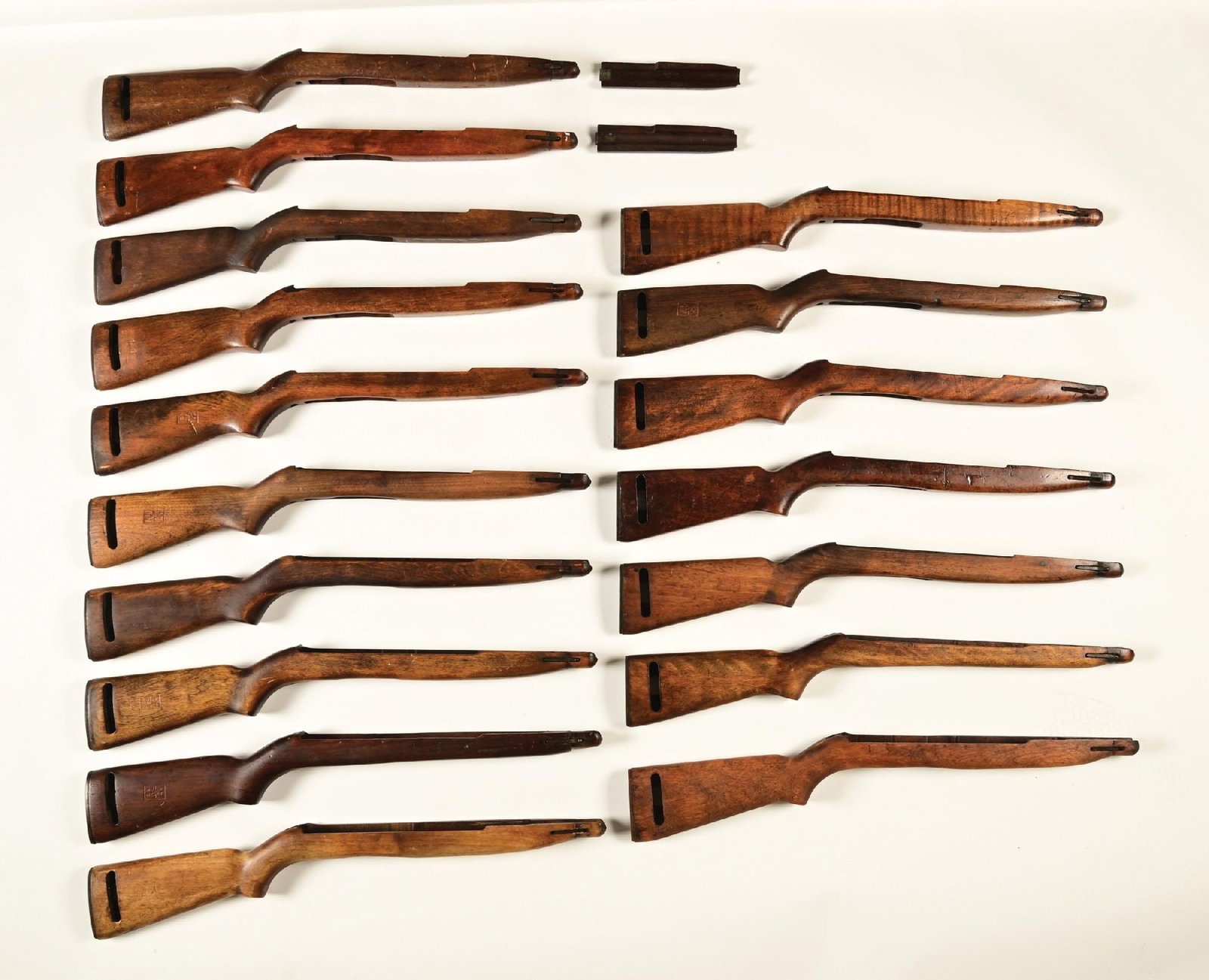 LOT OF 17 ITALIAN INSPECTED M-2 FAT BELLY CARBINE STOCKS.: 14 of these stocks are stamped with a star-FAT- and dated 1962, 67, 68,69,74, 77 and 1978. The FAT stamp indicates that these stocks were inspection stamped at the "Fabbrica d'Armi" arsenal in Terni. 