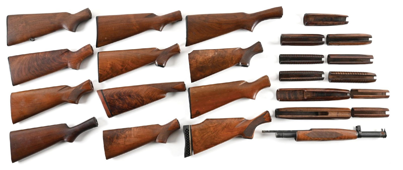 LARGE LOT OF (10) WINCHESTER MODEL 12 STOCKS AND (12) FOREARMS. (1 of 1)