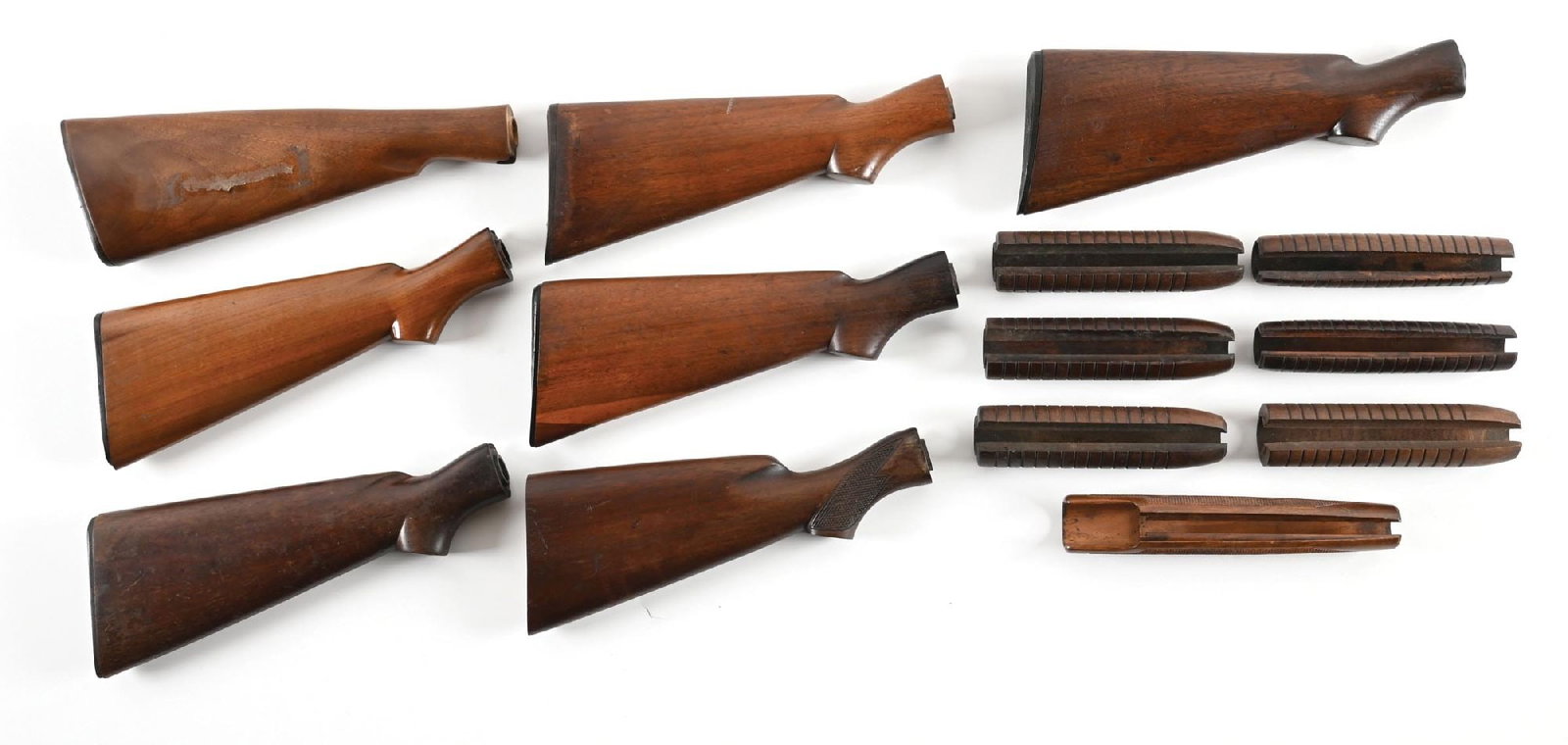 LOT OF (7) WINCHESTER MODEL 42 SHOTGUN STOCKS AND (7) FORENDS.: This large lot includes three period plain pistol grips stocks with gutta percha Winchester butt plates, all in fine condition. There are two additional period stocks in the same style, both with the 