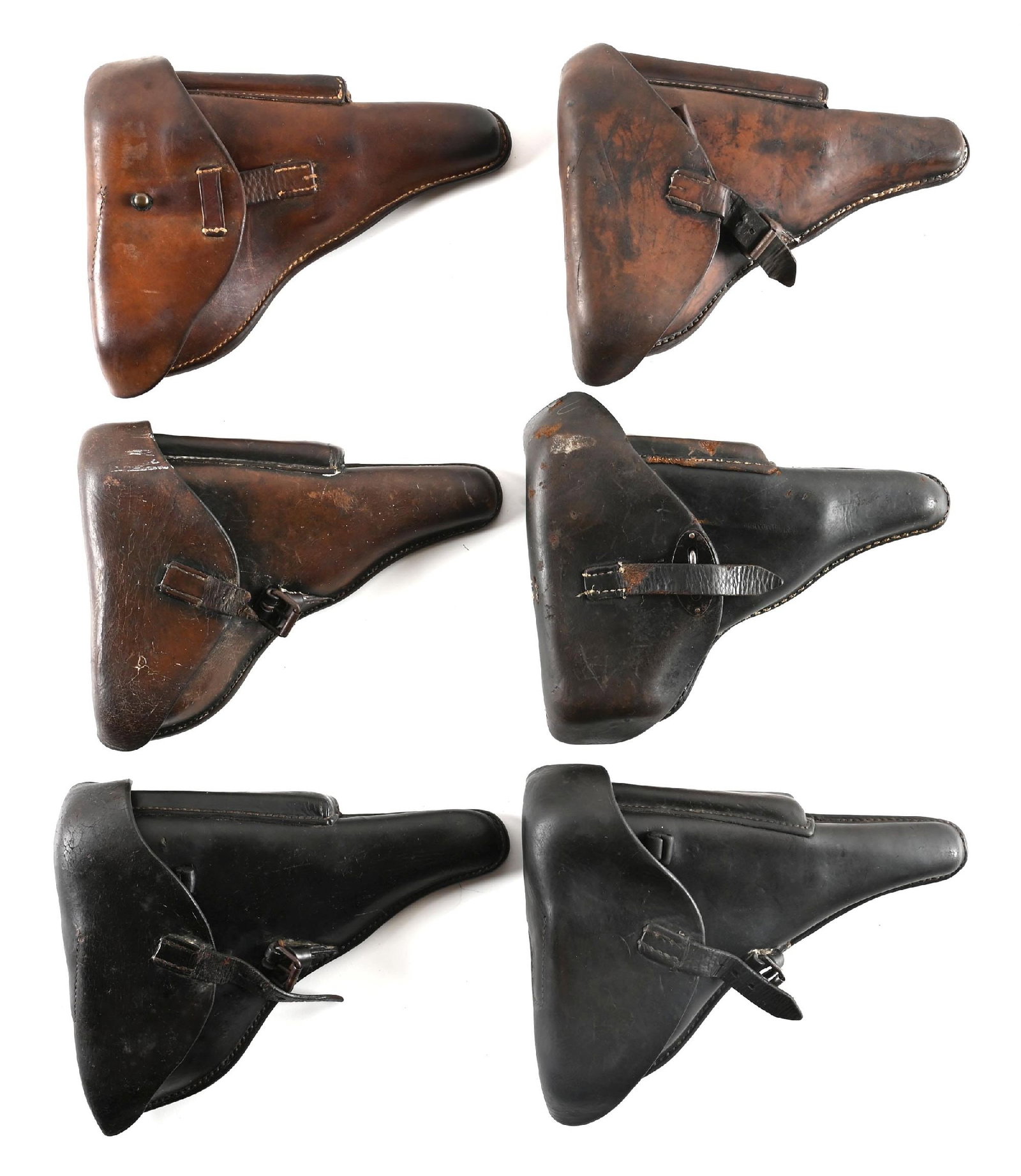 LOT OF 6: LUGER HOLSTERS.: One is actually made for a P38 and so stamped. One Luger holster is not maker stamped, one is stamped cdg 41, WaA 101, one is stamped Klinge Dresden 1936, one is police unit stamped Berlin 1929. The l