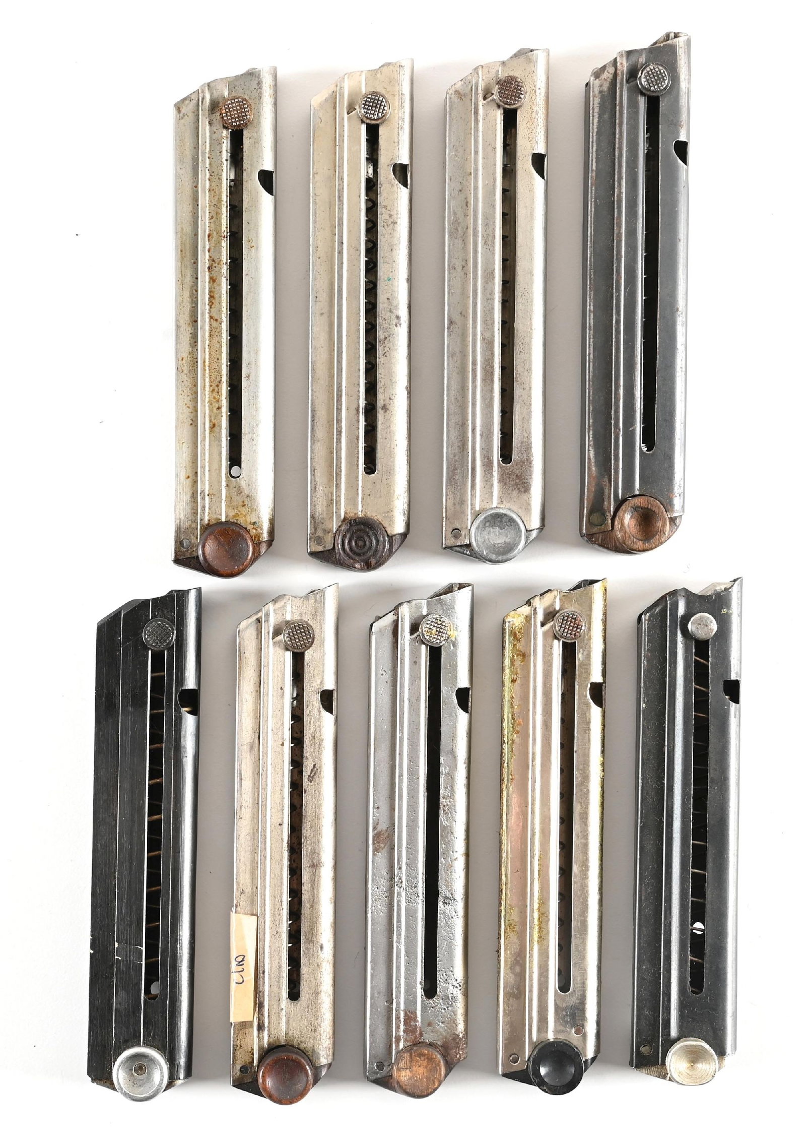 LOT OF (7) LUGER MAGAZINES.: Three are wood base, one is number #7589 and two have no number. There is one with a black bakelite base, two blued body with alloy base, one of which is numbered 808 and lastly an alloy base numbered