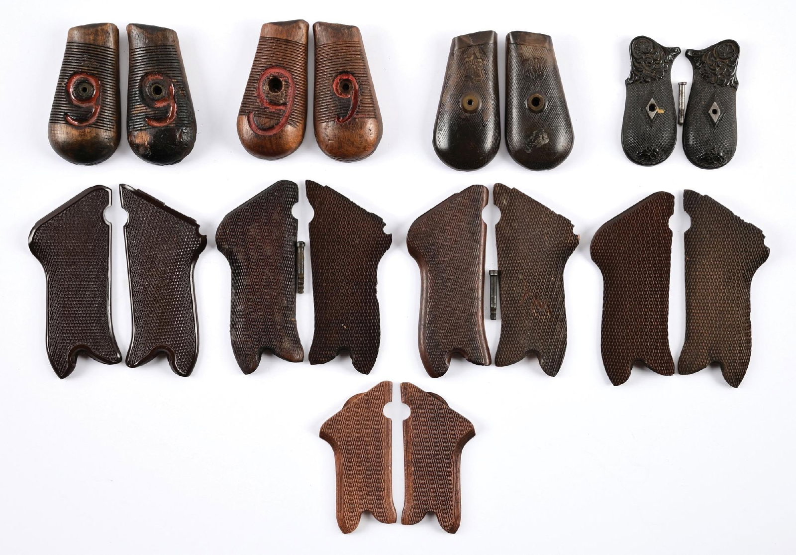 LOT OF (9) MISCELLANEOUS C-96 AND LUGER GRIPS.: Includes two sets of C-96 Red Nine grips, one is numbered 6072 while other set is number 26617, one set of gutta percha monogramed C-96 grips, one set of gutta percha grips for German revolver, one se