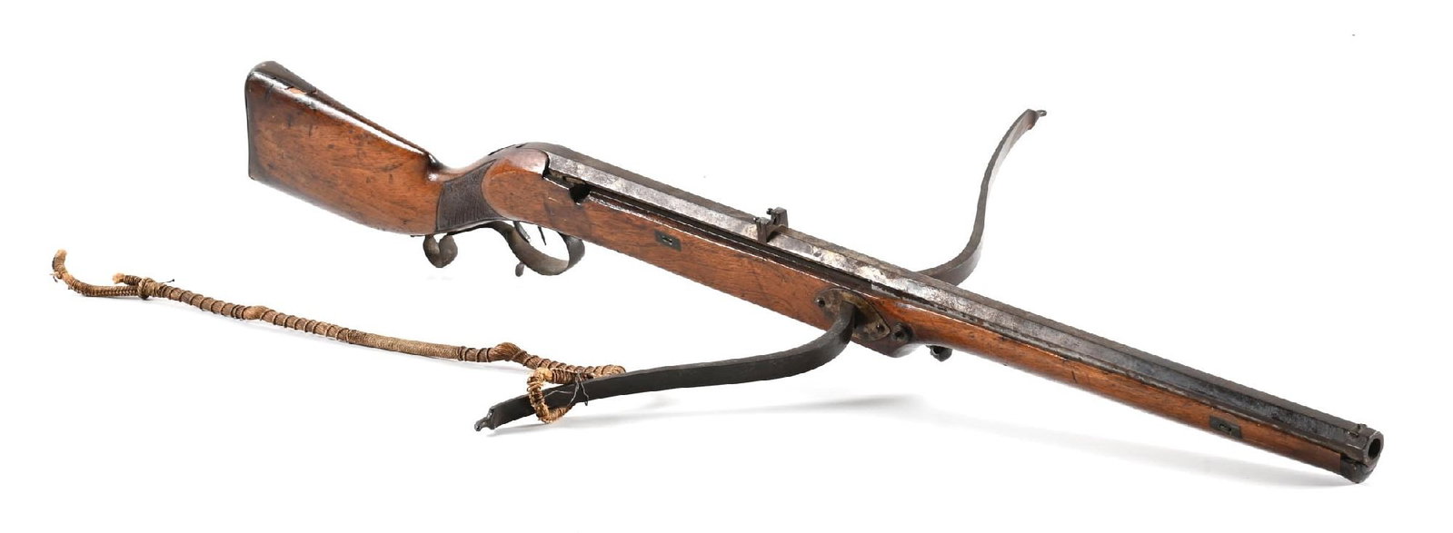 SLURBOW.: Slurbows were designed with a barrel after the emergence and success of the pistol and musket. The barrel is slotted at the rear for feeding the string. Measures 22 - 3/8" across the prod and